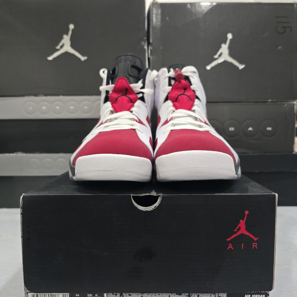 This is a Nike Air Jordan 6 Retro "Carmine" sneaker in the white, black, and car